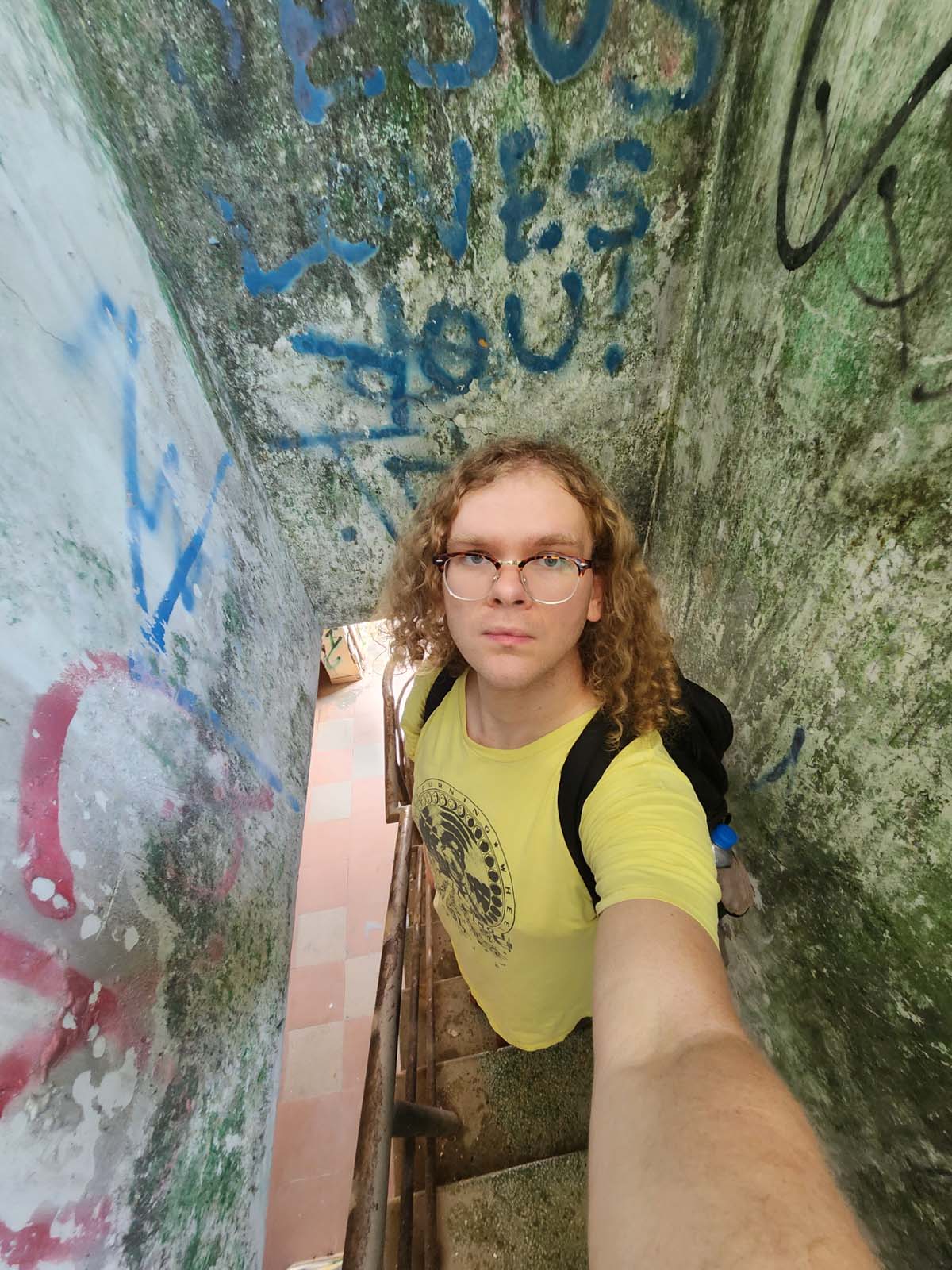 Damian's selfie descending the narrow staircase, a few feet too tall to go down without ducking.