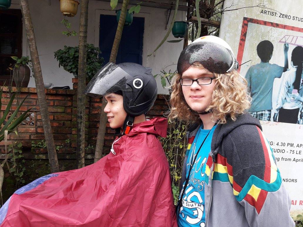 A photo from 2018 of Damian and a family acquaintance on a motorbike.