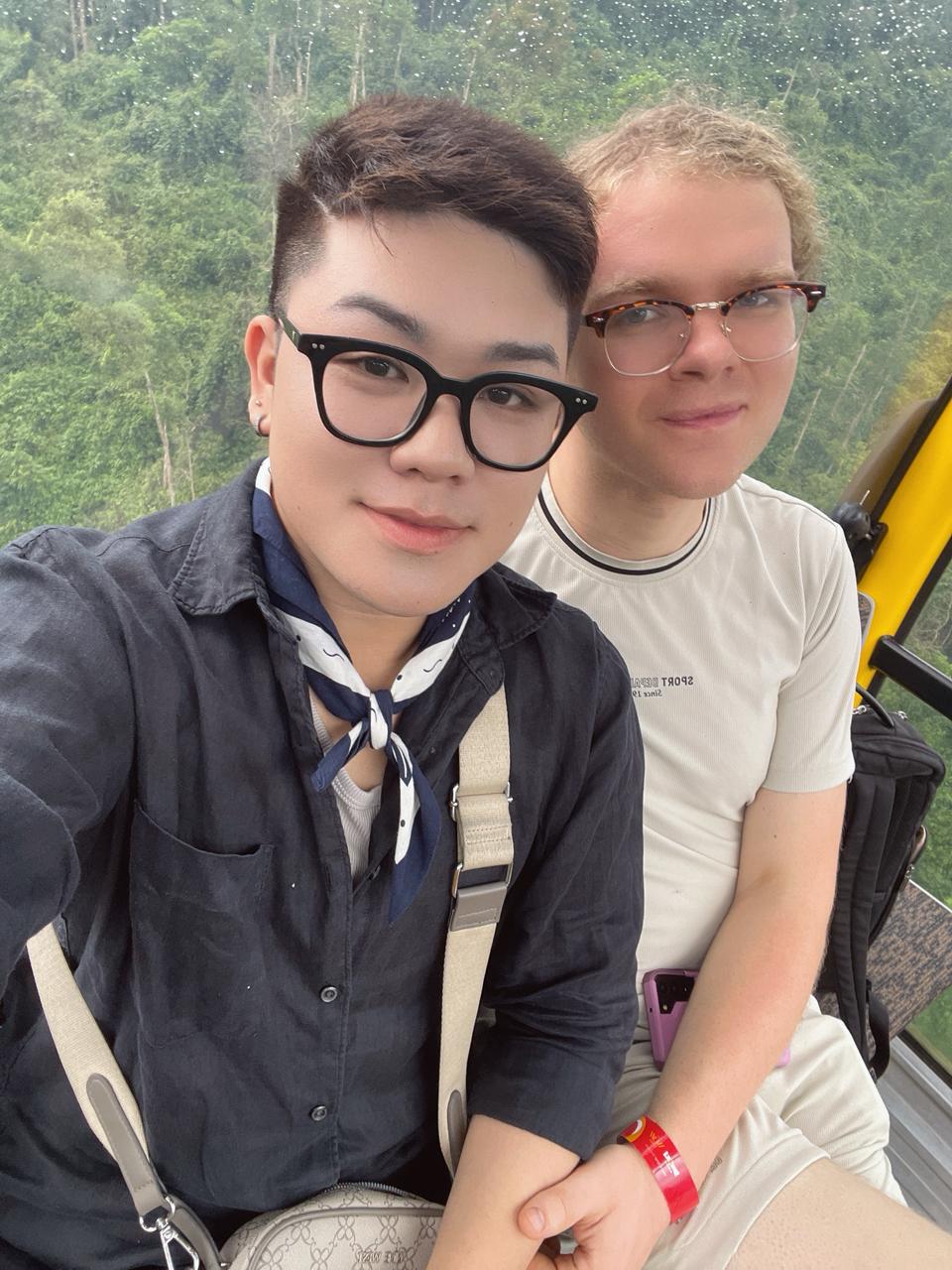 Ben and Damian's selfie on the cable car, smiling warmly at the camera.